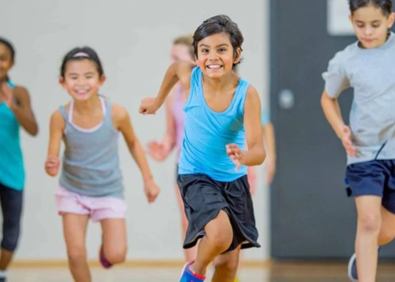 2 Column Children Running In Sports Hall
