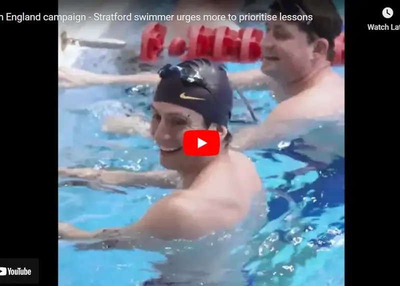 Video screengrab of man in swimming pool in black swim cap