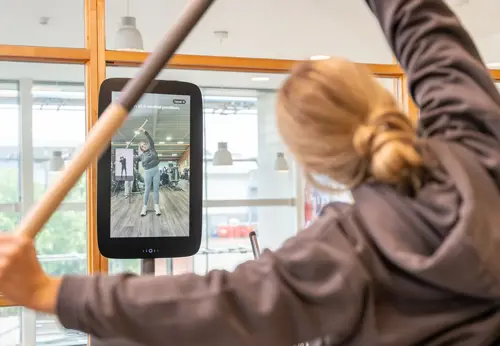 Customer testing their flexibility with EGYM machine