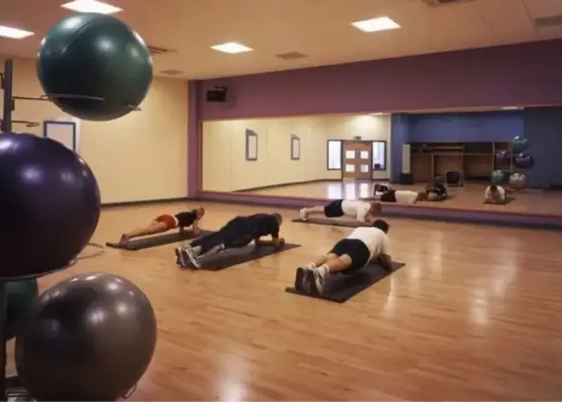 Three people in group workout studio