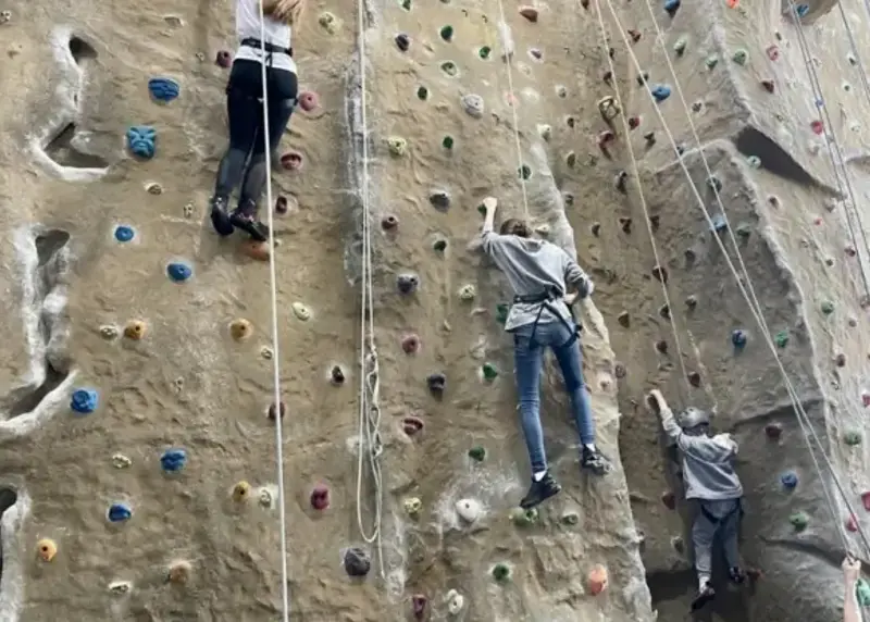 Juniors using climbing wall at Elmbridge