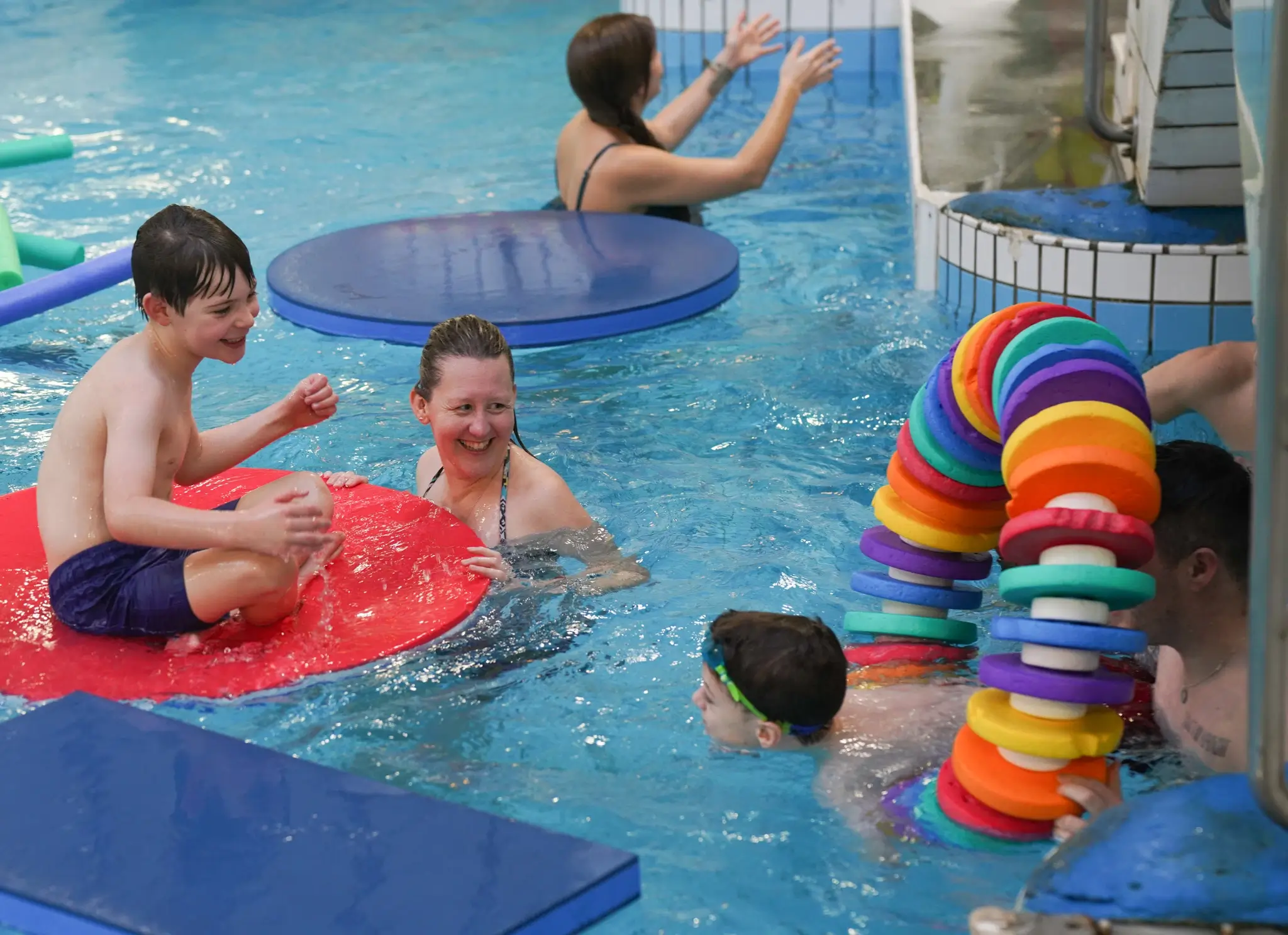 Group of people playing in a swimming pool