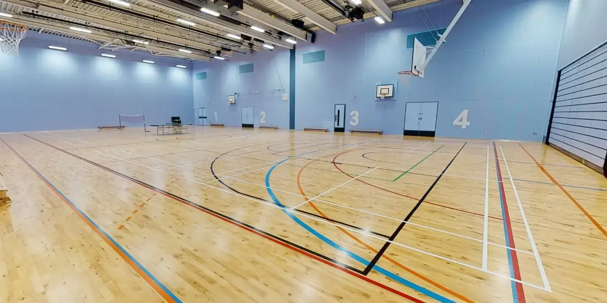 Sports hall with badminton net and table tennis table