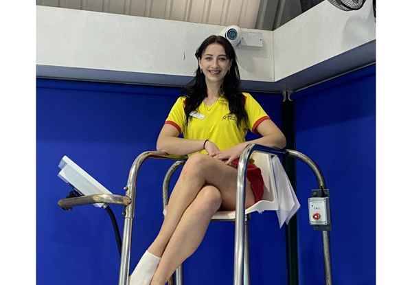 Female lifeguard sat on raised chair