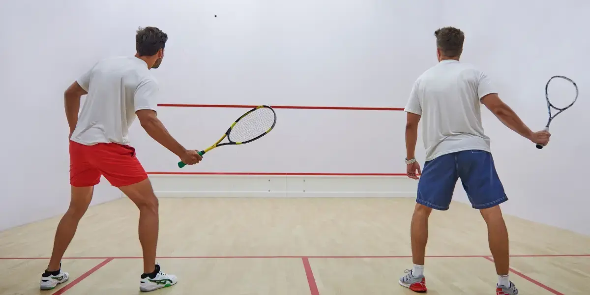 Two men playing squash